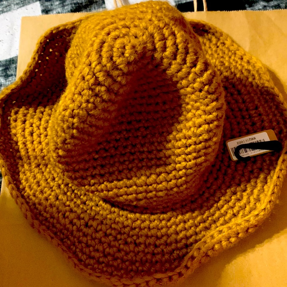 Cute brown new crocheted hat with wire brim.